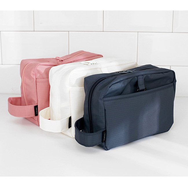 Travel toiletry bag with hand strap