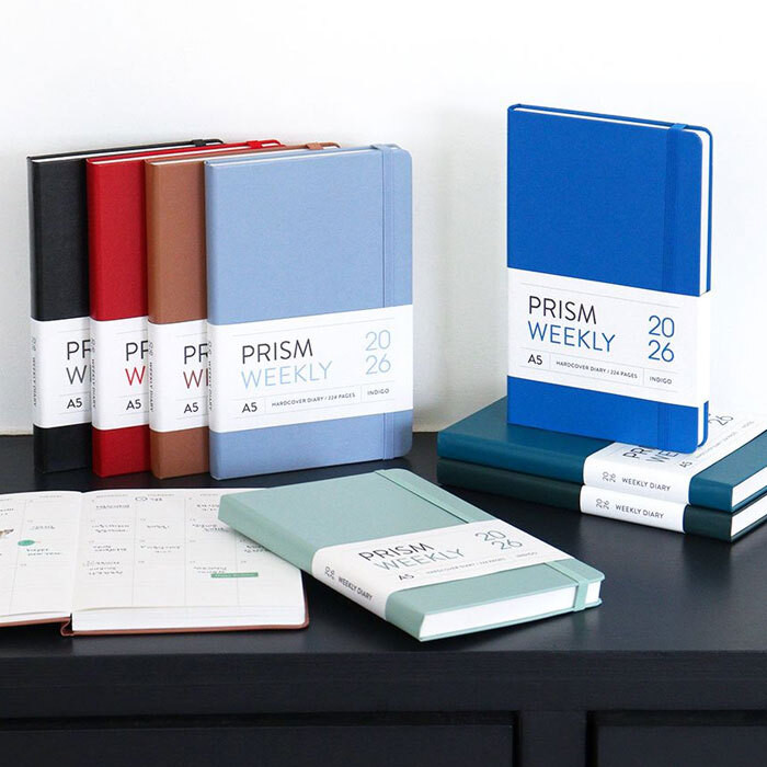 A vibrant display of the 8 different color options available for the Prism A5 planner.
