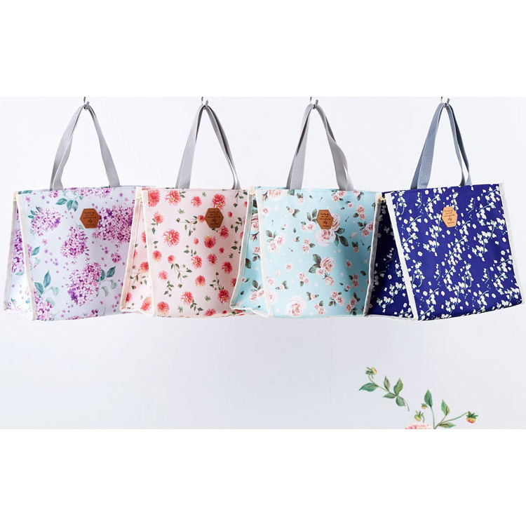 Blossom pattern multi zippered tote bag