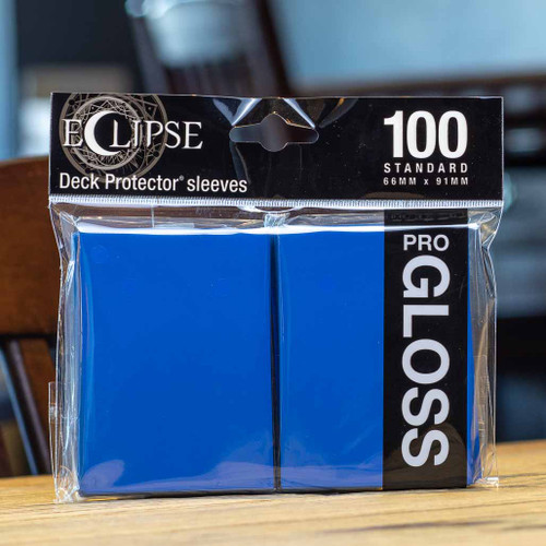 https://cdn11.bigcommerce.com/s-7eepw5u9z2/products/1583/images/1763/f2dab1e2Eclipse-Deck-Protector-Sleeves-100-Standard-Pro-Gloss-Blue-Mox-Boarding-House-Seattle__65805.1626292567.500.750.jpg?c=1