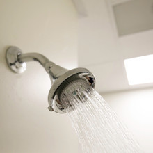 Chrome Earth Luxe  on shower arm with spray turned on