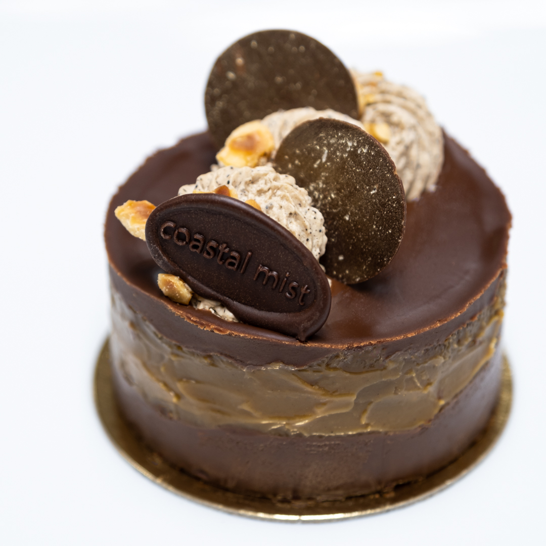 A HAZELNUT and dark chocolate base is topped with a dark chocolate ganache and swirled with a coffee caramel, and topped with espresso whipped cream.