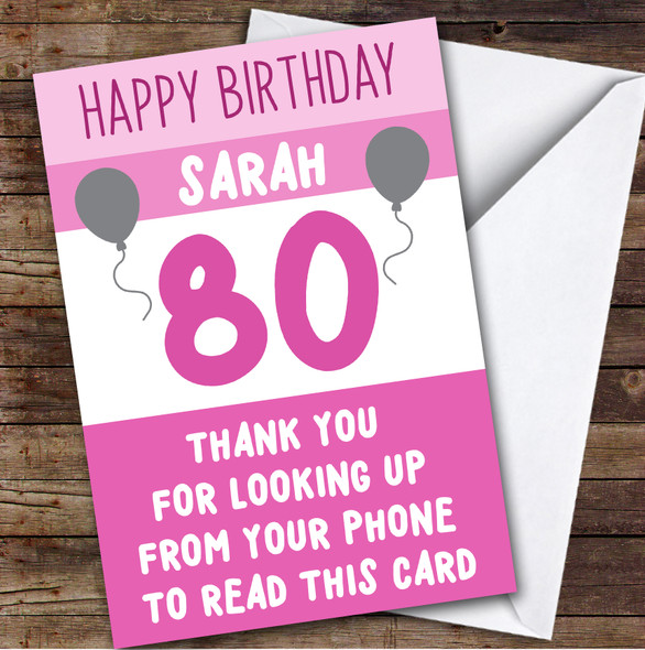Birthday Card Personalised 80th Female Looking Up From Phone Pink Balloons