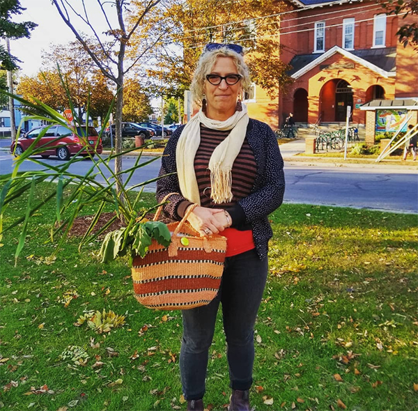 Person standing holding basket