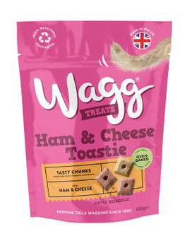 Pink Wagg Ham & Cheese Toastie dog treat bag with dog tail graphic, and product chunks.