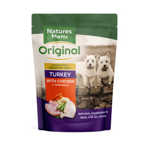 Dog food pouch, white and purple, with two dogs, turkey and chicken with vegetables.