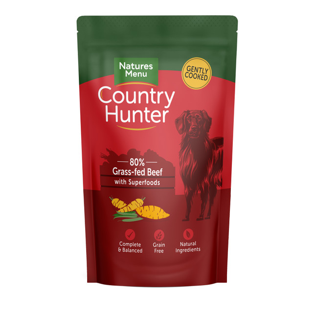 Red dog food pouch, "Country Hunter" branding, dog illustration, "80% grass-fed beef" text, green and yellow accents.
