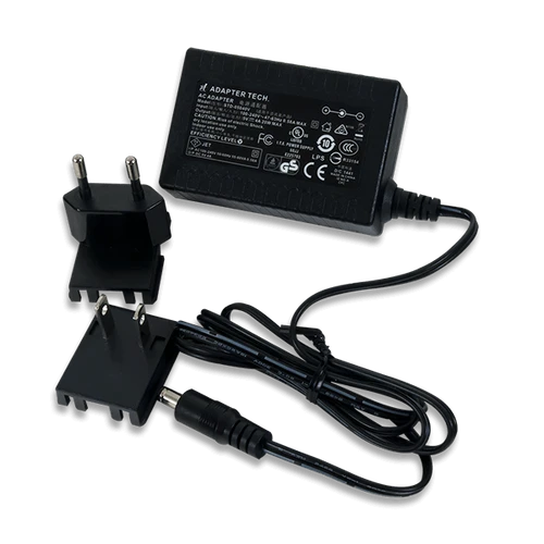 5V 4A Switching Power Supply product image with the included wall plug adapters.