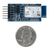 Size comparison product image of the Pmod BT2: Bluetooth Interface and a US quarter (diameter of quarter: 0.955 inches [24.26 mm]; width: 0.069 inches [1.75 mm]). 