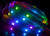 Product image of the WS2812 Addressable LED lit up and in use with a dark background to highlight the different colors displayed. 产品形象的WS2812可寻址LED照明和使用与黑暗的背景突出不同的颜色显示。
