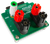 Product image of the Current and Power Adapter for Analog Discovery, displayed at an angle. 