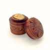 Auric Blends Amber Butter Perfume - 1/5 oz. solid, wooden container with an intricate carved design and a partially opened lid revealing the solid perfume inside. Auric Blends Amber Butter Perfume - 1/5 oz. solid, wooden container with an intricate carved design and a partially opened lid revealing the solid perfume inside.