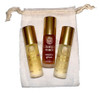 Kuumba Made Earthy Sophistication Collection - 3 assorted fragrance oils, 0.15 oz each, in frosted glass bottles with gold caps, placed in a white fabric drawstring pouch.