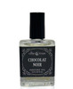 Ollie + Max Chocolat Noir Vegan Perfume Oil - 1/2 oz, small transparent glass perfume bottle with a black label and black cap.