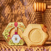 Baudelaire Pure Honey Soap - 3.5 oz., handcrafted honey-based soap with honeycomb design, presented with honey dripping from the top, in eco-friendly packaging.
