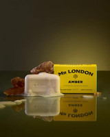 Wavertree & London Mr London Amber Soap Bar - 10oz (280g), yellow packaging with black text, soap bar with amber scent, surrounded by amber stones, with soap foam and reflective surface.