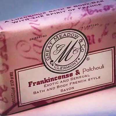 Great Meadow Frankincense & Patchouli Luxurious Bath & Body Bar - 5 oz., pink packaging with black and red text and logo.