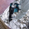 Makita HM0871C SDS Max Demolition Hammer with AVT (110V) in use demolishing concrete