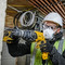 Dewalt D25033K 3 Mode SDS Plus Hammer Drill (110V) at work drilling a hole 