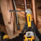 Dewalt DT4763 drills in a tight spot into a joist