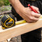 XTrade X0900032 Metric/Imperial Tape Measure 8m in use on jobsite
