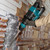 Makita DHK180Z 18V LXT SDS Plus Power Scraper (Body Only) in use chipping tiles off of a wall