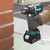 Makita DLX2202TJ1 50th Anniversary 18V LXT Brushless Combo Kit (2 x 5.0Ah Batteries) in MakPac Case combi in use drilling brickwork