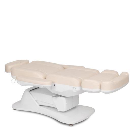 Sterling Electric Facial Bed shown from three-quarter view to the right flat and lowered