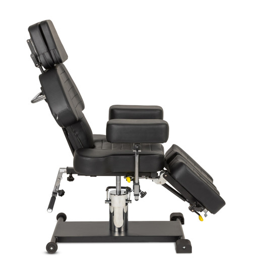 Nova Hydraulic Multifunction Tattoo Chair in Black from the side with back partially reclined and legs partially extended Nova Hydraulic Multifunction Tattoo Chair in Black from the side with back partially reclined and legs partially extended