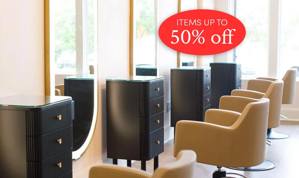 Knoll styling stations in black with saddle Venturi styling chairs and gold Avalon LED mirrors