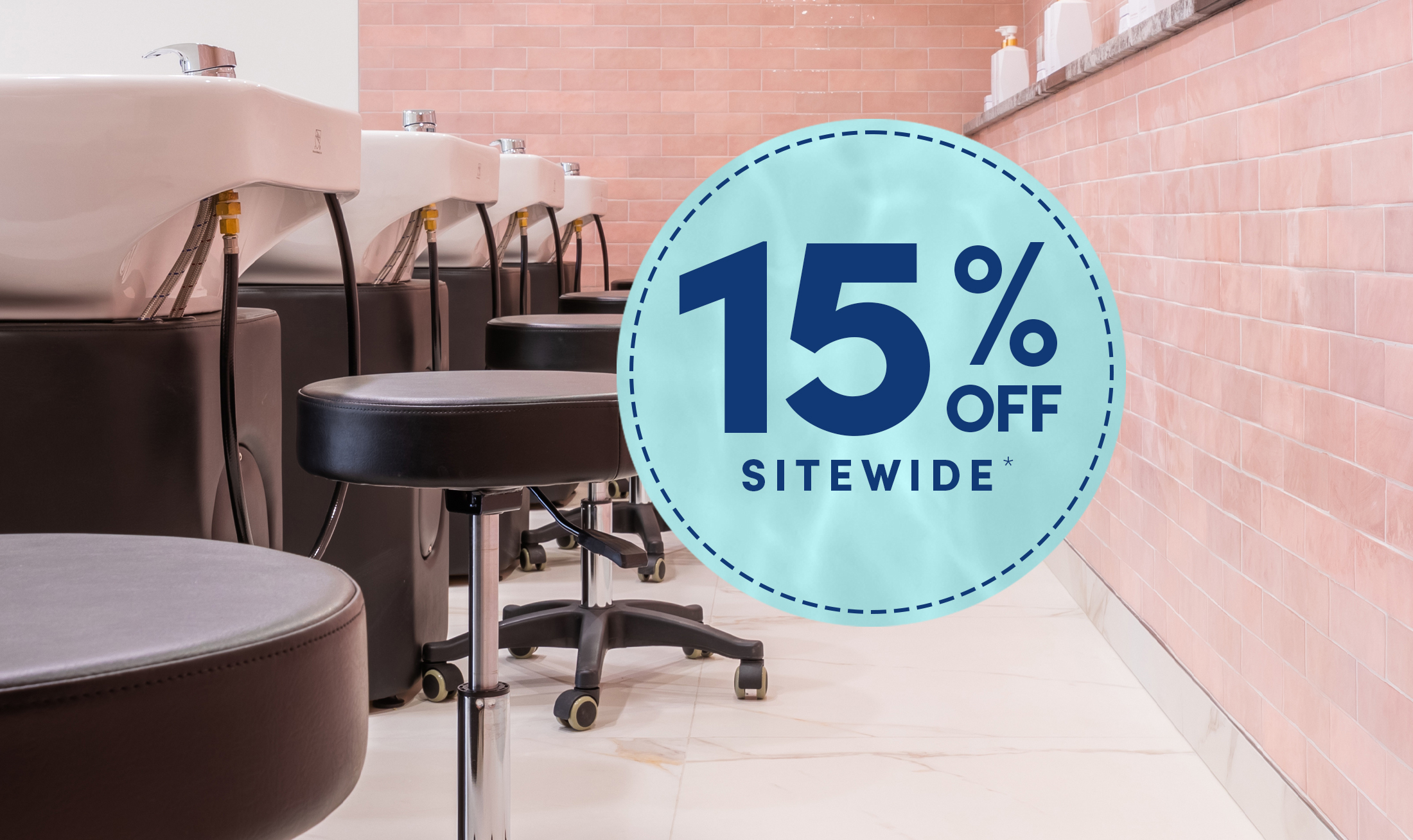 Lineup of black salon and spa tech stools in black behind a line of black shampoo systems in a salon