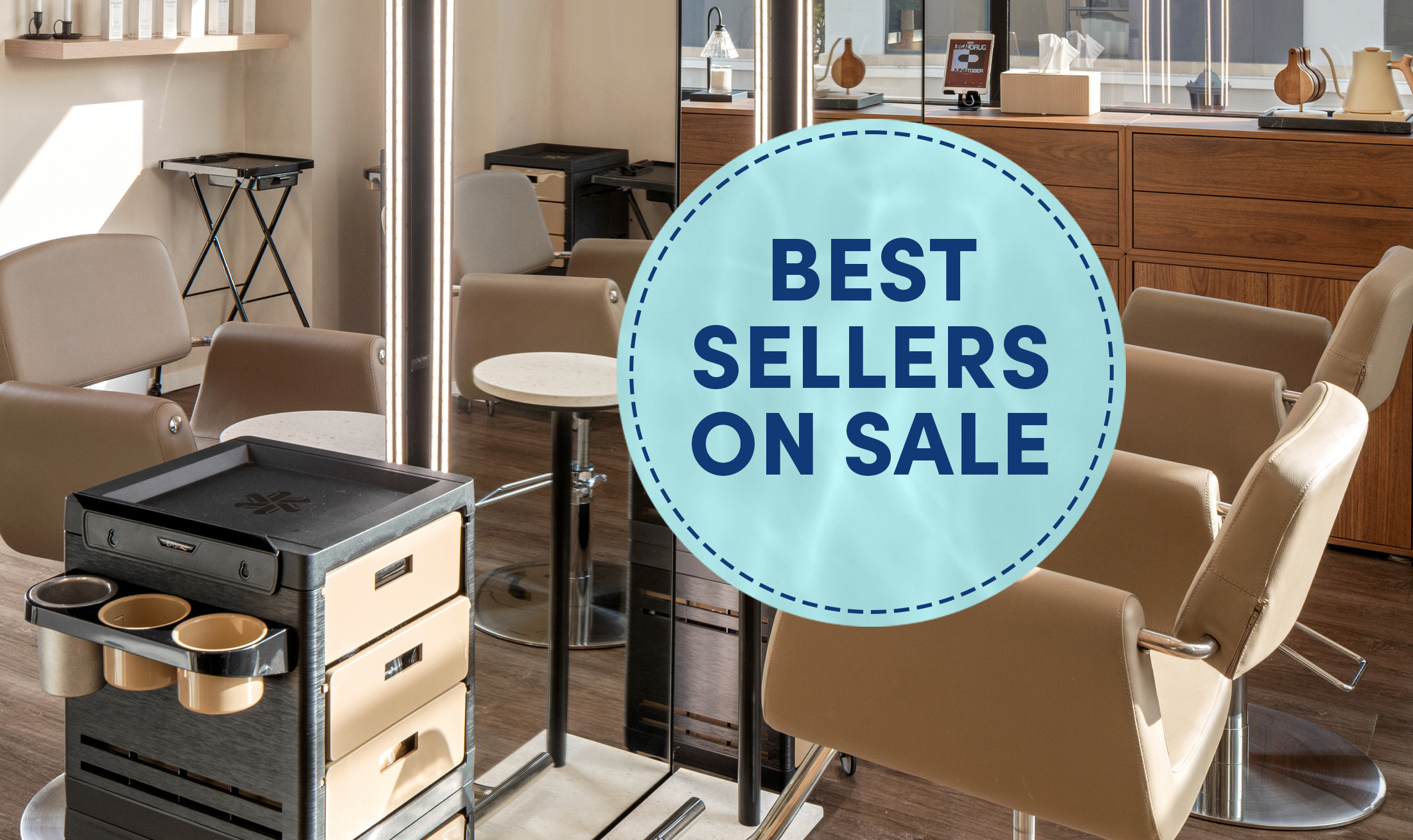 Black and beige mobile salon carts with color storage, appliance rings, and drawer storage next to LED salon mirrors and beige salon styling chairs in a salon