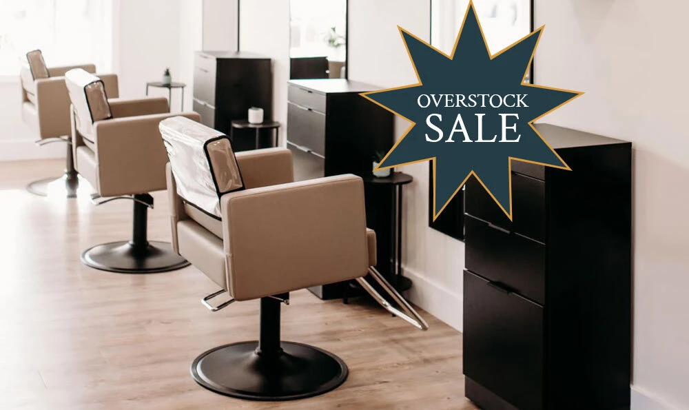 Knoll styling stations in black with saddle Venturi styling chairs and gold Avalon LED mirrors