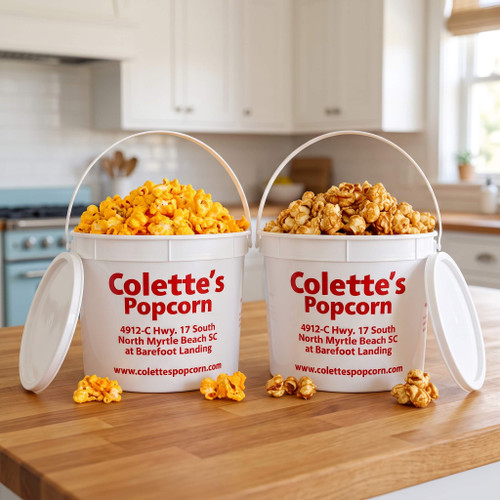 Two 1.1-gallon party buckets of handcrafted yellow cheddar and caramel gourmet popcorn from Colette's Popcorn at Barefoot Landing in North Myrtle Beach.