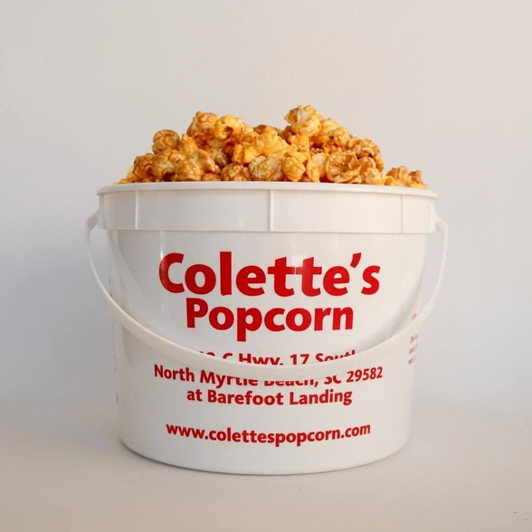 Colette's 1-gallon jumbo bucket filled with handcrafted Beach Blend popcorn, featuring a sweet and savory mix of rich copper kettle caramel and sharp yellow cheddar.