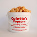 Colette's Popcorn 1 gallon jumbo bucket filled with handcrafted small-batch caramel popcorn.