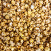 Close-up texture of jumbo mushroom popcorn coated in scratch-made brown sugar and butter caramel glaze.