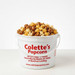Colette's Popcorn 1-gallon jumbo bucket filled to the brim with Durty Myrtle popcorn, featuring an artisan trio of copper-kettle caramel, sweet and salty kettle corn, and buttery toffee.