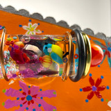 Detail: Handmade lampwork tiny glass bird in object cylinder