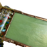 Detail: Artist signature on back panel