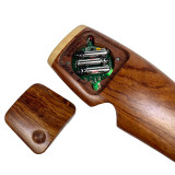 Detail: Press recessed circle to release magnetic door, revealing battery/light compartment and artist signature