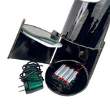 Detail: Compartment open showing batteries, wall plug, black & white background slot, and artist signature