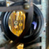 Detail: View through lens of triple free-spinning wheels