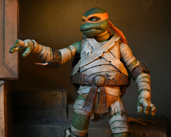 NECA Universal Monsters x Teenage Mutant Ninja Turtles Ultimate Michelangelo as The Mummy 7-Inch Scale Action Figure