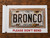 HangTime Bronco Rust Background 6 x 12 Embossed aluminum license plate