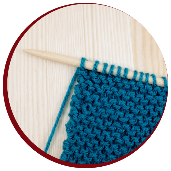 blue yarn being knitted