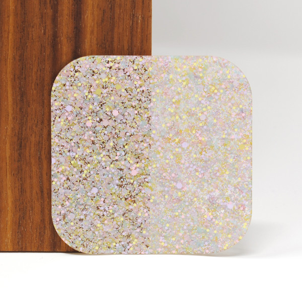 Easter Confetti acrylic sheet ??? 3mm clear cast acrylic with pastel flakes, ideal for laser cutting, jewelry making, and craft projects. Sample shown against wood and white background.