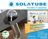Solatube Skylight kit showing roof dome, internal tubing, and promotional materials highlighting benefits and model number.