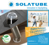 Solatube skylight dome on roof with reflective tubing, and square ceiling fixture, promoting energy efficiency and easy installation.