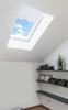Solatube Premium Fixed Skylight with partially drawn shade, showing blue sky.